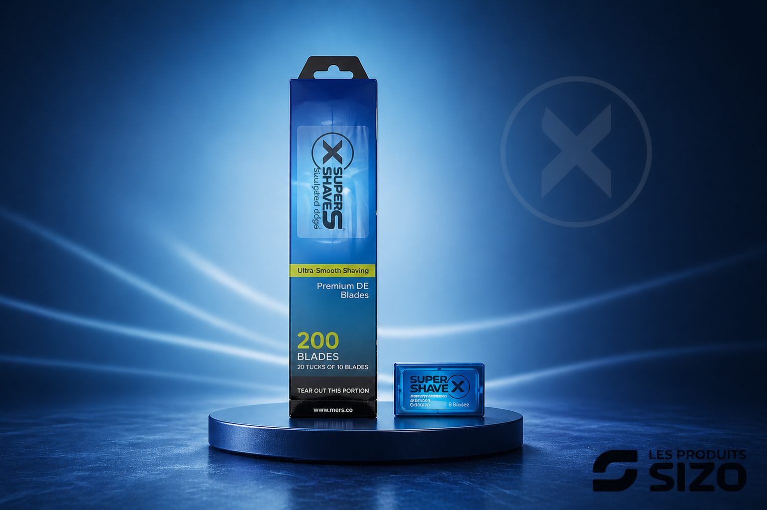 Blue box of Super Shave X Premium DE blades (200 blades) on a circular pedestal with a small blue case beside it on a blue-lit background.