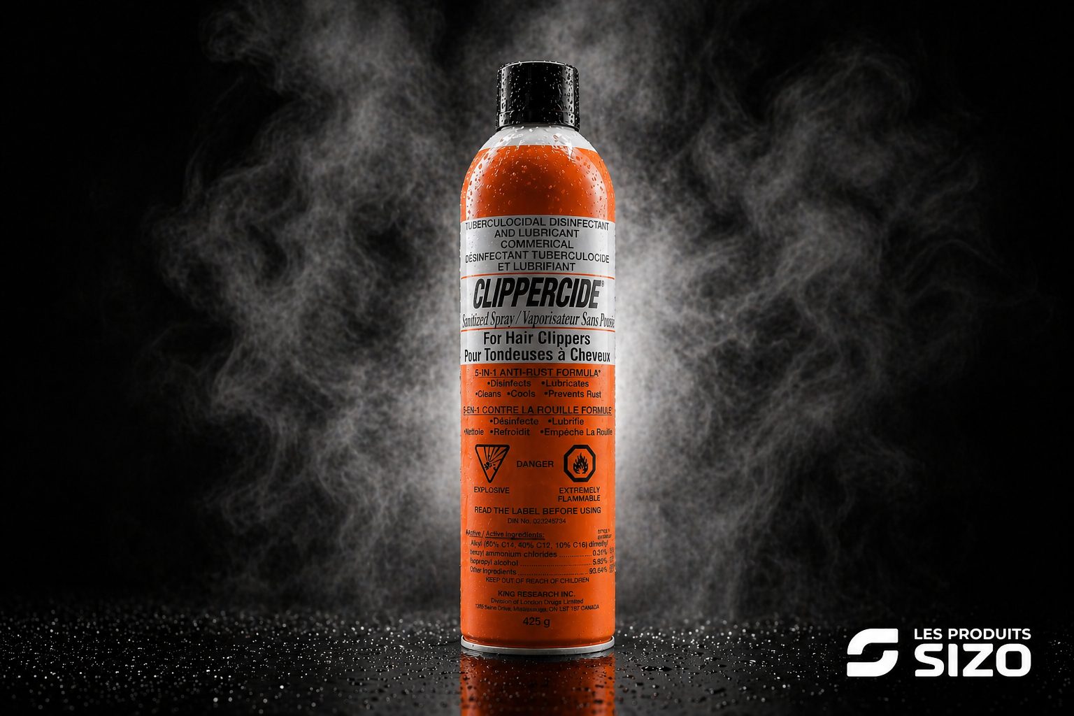 Clippercide sizo - Les Produits Sizo Orange ClipperCide disinfectant spray for hair clippers, black cap, on a reflective surface with a smoky dark background; brand logo bottom right.